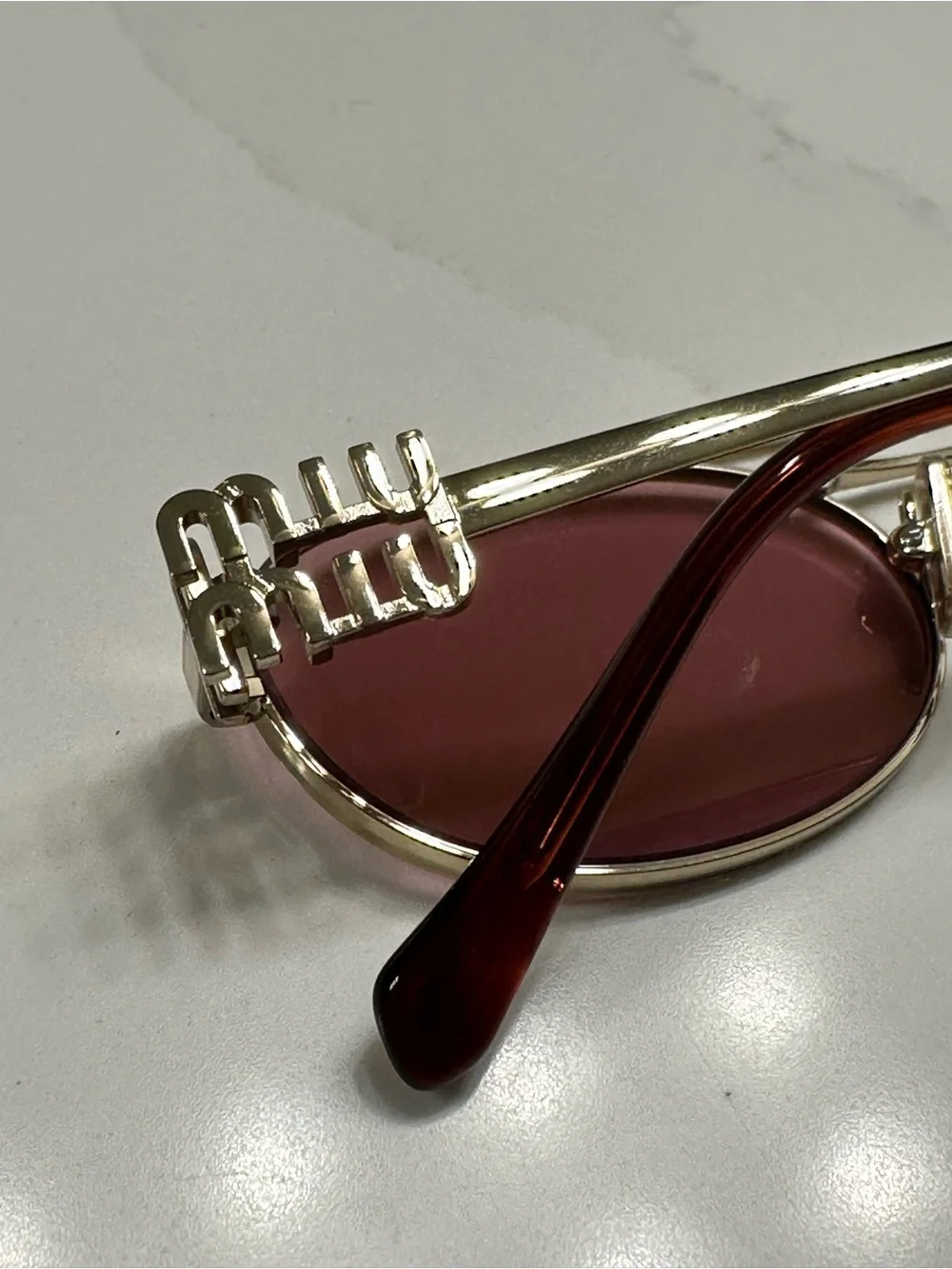 Miu Miu Gold Frame Sunglasses with Pink Lenses